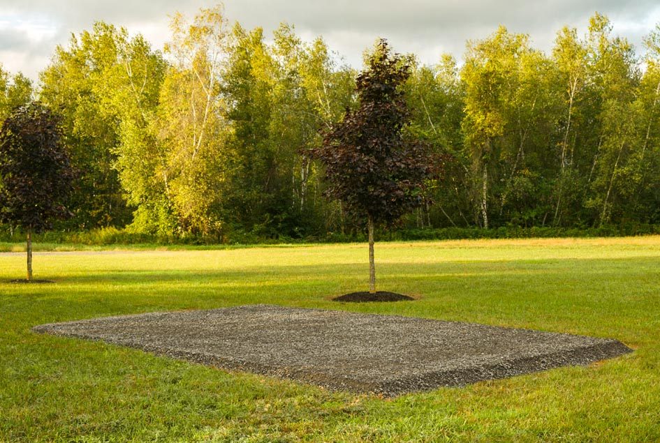 Storage building pad leveled with crushed stone