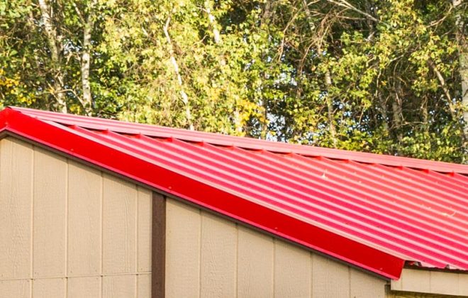 Red tin roof on a Cozy Cottage built by Adirondack Storage Barns