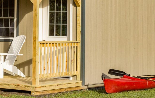 The porch of a clay colored ADK Cabin built by Adirondack Storage Barns