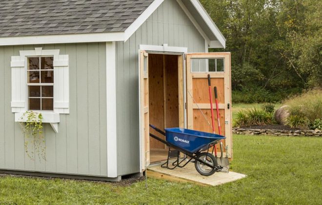 Light gray Elite Utility Shed with the side door open built by Adirondack Storage Barns