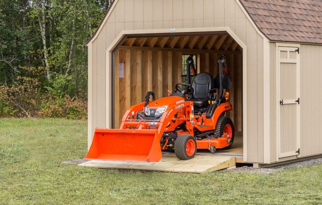 Garden at the door of a Buckskin High Barn Carriage Shed built by Adirondack Storage Barns