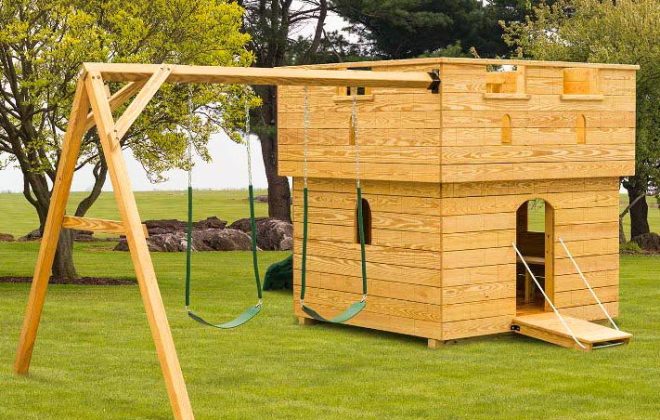 Small wooden Castle playground built by Adirondack Storage Barns